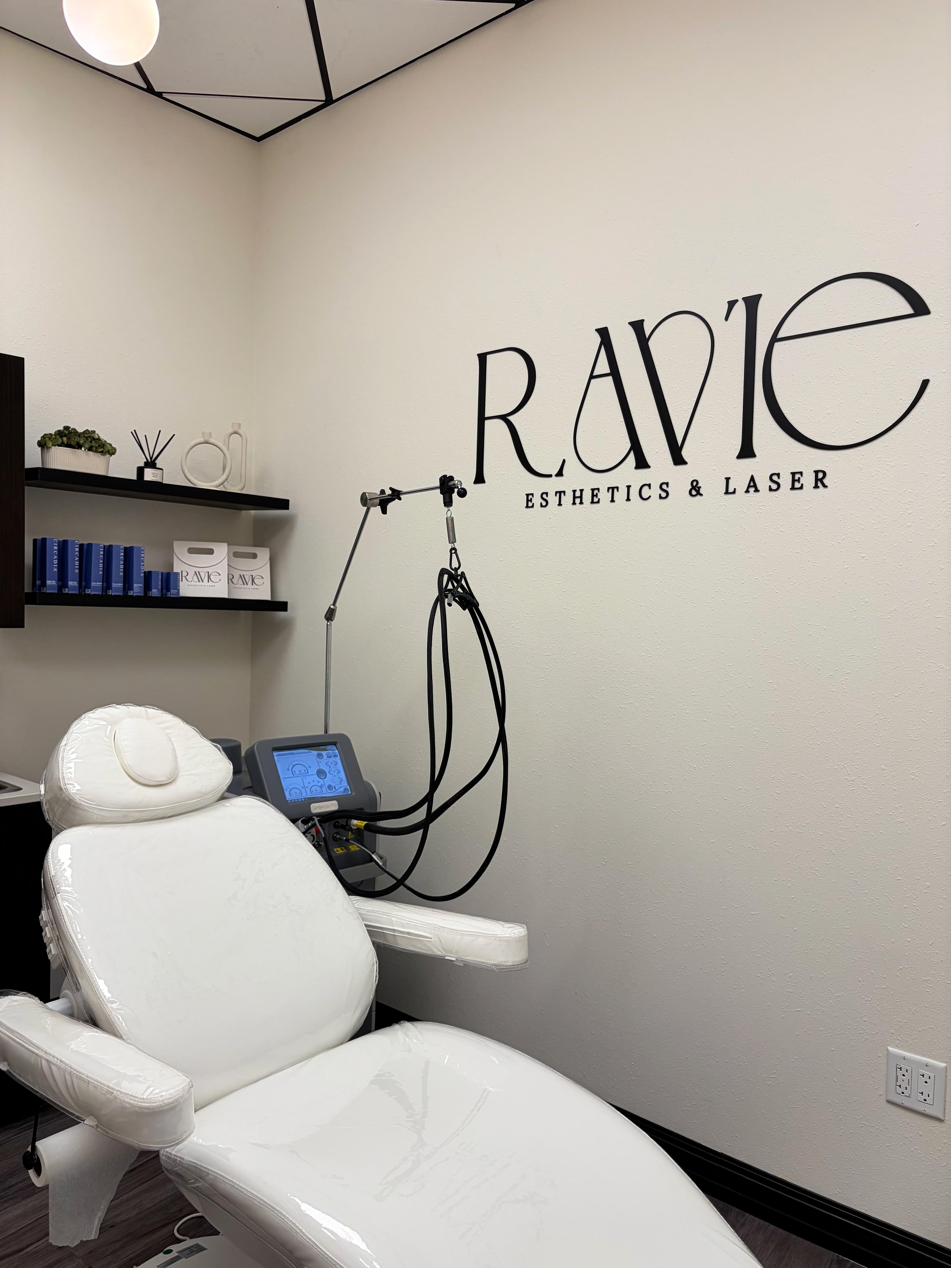 Ravie Esthetics & Laser treatment room with signature wall signage